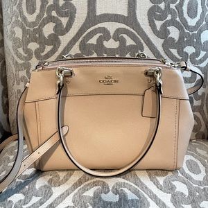 Coach handbag/crossbody bag. Nude coloring with three compartments.
